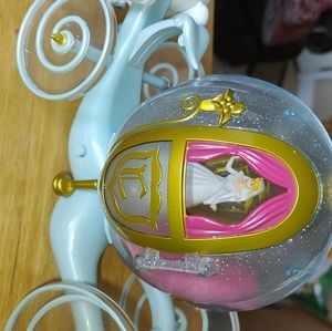 Cinderella carriage w/Cinderella doll, purchased at Disney.